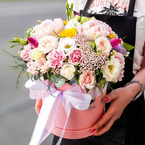 Box with flowers and macaroons